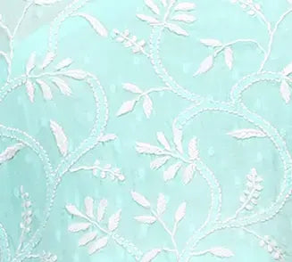 White floral pattern on a light blue background