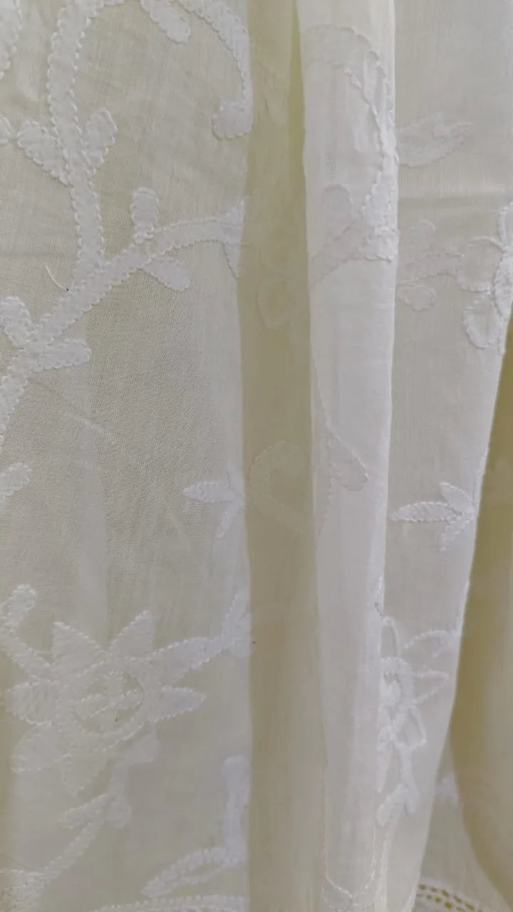 Close-up of a Hand Embroidered  chikankari fabric with a neutral background