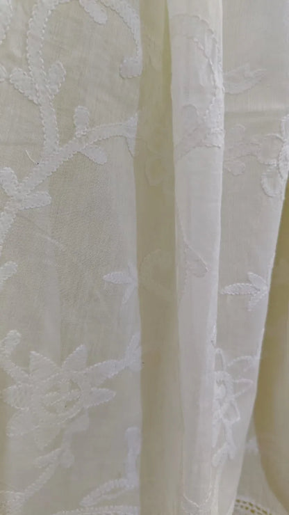 Close-up of a Hand Embroidered  chikankari fabric with a neutral background