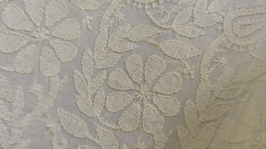 Close-up of Bakhiya chikankari embroidery  on  fabric with a light color on a white background